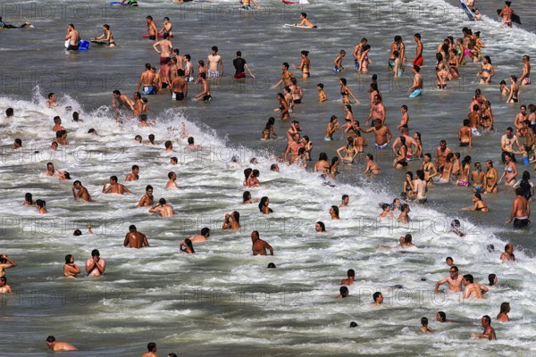 View from above on crowd in the surf, tourists swimming in the sea, enjoying cooling off, fun, Grand Plage in summer, Biarritz, Basque Coast, Aquitaine, Département Pyrénées-Atlantiques, Nouvelle-Aquitaine, France, Europe