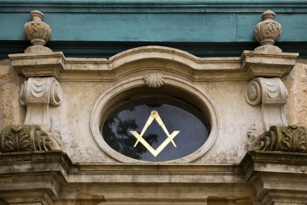 Close-up with compass and angle, two of the best-known symbols of Freemasonry on the lodge house, Hildesheim, Lower Saxony, Germany, Europe