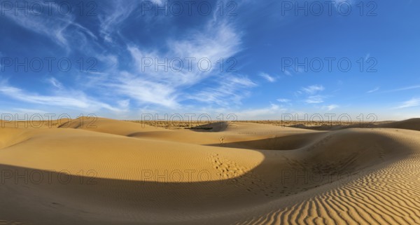 Panorama of dunes landscape with dramatic clouds in Thar Desert. Sam Sand dunes, Rajasthan, India, Asia