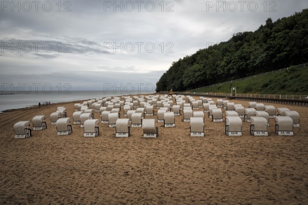 Rainy weather at the Baltic Sea, empty beach chairs, single walkers, view from above, long exposure, Baltic resort Sellin, Rügen Island, Mecklenburg-Western Pomerania, Germany, Europe