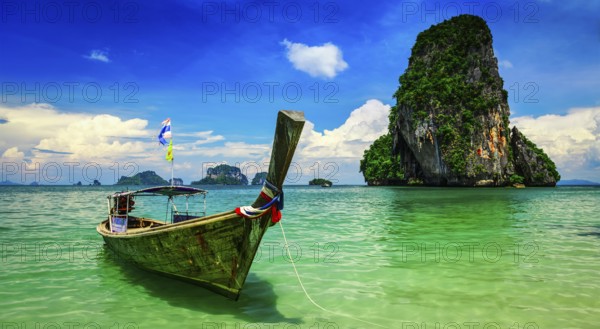 Panorama of long tail boat on tropical beach (Pranang beach) and rock, Krabi, Thailand, Asia