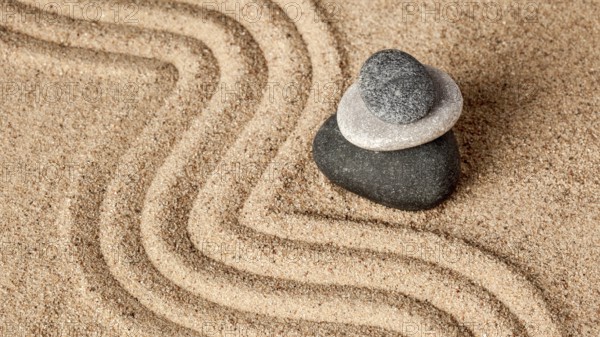 Japanese Zen stone garden, relaxation, meditation, simplicity and balance concept, panorama of pebbles and raked sand tranquil calm scene
