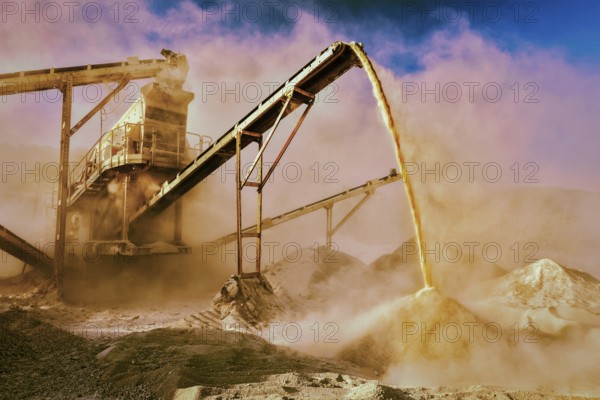 Vintage retro effect filtered hipster style image of Industrial background, crusher rock stone crushing machine at open pit mining and processing plant for crushed stone, sand and gravel