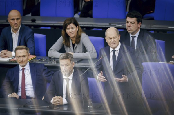 (L-R) Christian Lindner (FDP), Federal Minister of Finance, Robert Habeck (Alliance 90/The Greens), Federal Minister of Economics and Climate Protection and Vice-Chancellor, and Olaf Scholz (SPD), Federal Chancellor, during a government enquiry in the German Bundestag. Berlin, 15 November 2023, Berlin, Germany, Europe
