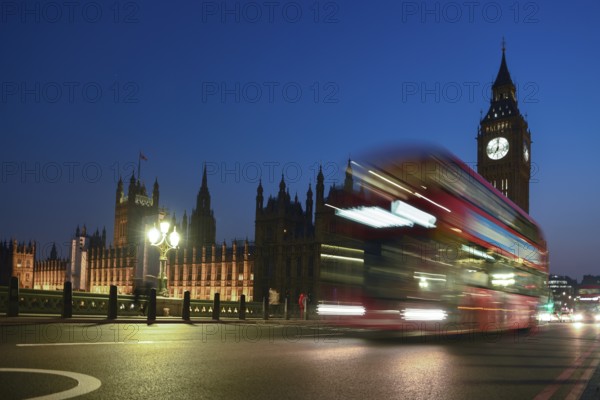 Red double-decker bus on Westminster Bridge, blue hour, Big Ben in the background, Westminster, London, England, United Kingdom, Europe