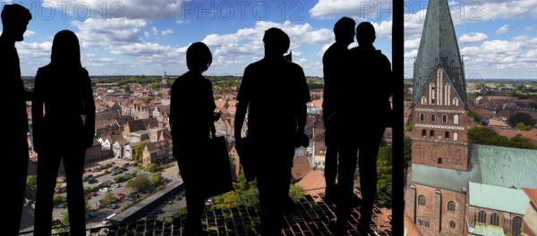 View of the old town from the historic water tower, visitors silhouetted in front, Lüneburg, Nierdersachsen, Germany, Europe