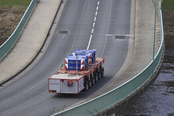 Heavy-duty bridge test Load test on the closed Elbe bridge in Bad Schandau. The load-bearing capacity of the bridge is to be tested using autonomously moving heavy-duty modules with continuously increasing loads of up to 80 tonnes. More than 50 microphones were attached to the structure for this purpose, which are intended to make prestressing steel fractures inside the structure audible by measuring sound emissions. If no prestressing steel fractures can then be detected, the bridge could be partially opened to traffic from May. Cars and light lorries up to 3.5 tonnes as well as special trips for buses could then pass. However, monitoring of the bridge continues, Bad Schandau, Saxony, Germany, Europe