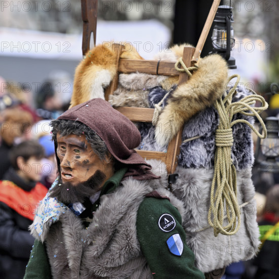 Person masked as a mountaineer at the carnival parade of the Wey guild on Rose Monday, Güdismäntig, Lucerne Carnival 2024, Lucerne, Switzerland, Europe