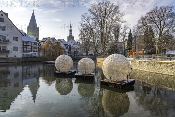 City view with decorative baubles and Soest lettering on the large pond in Soest, North Rhine-Westphalia, Germany, Europe