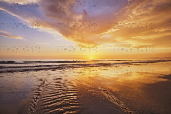 Atlantic ocean sunset with surging waves at Fonte da Telha beach, Costa da Caparica, Portugal, Europe