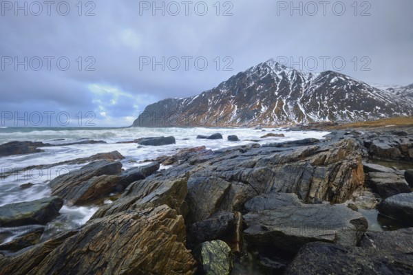 Rocky coast of fjord of Norwegian sea in winter. Lofoten islands, Norway, Europe