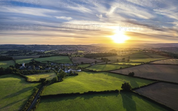Sunset over Devon Fields from a drone, Berry Pomeroy, England, United Kingdom, Europe