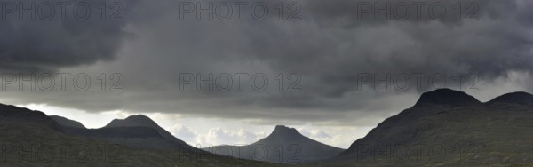 Highland scenery with rain clouds at Assynt, Sutherland, Scotland, UK