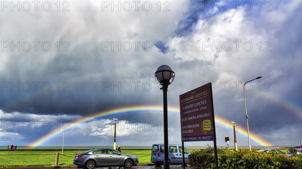 View of the coast road from the Strand Hotel, double rainbow in the cloudy sky, Bray, Wicklow, Ireland, Europe