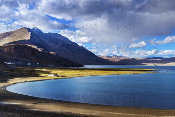 Himalayan lake Tso Moriri and Korzok village in Himalayas on sunset, Ladakh, India, Asia