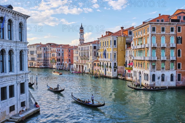 VENICE, ITALY, JUNE 27, 2018: Grand Canal with boats and gondolas on sunset, Venice, Italy, Europe