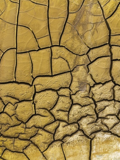 Mineral-rich cracked earth at the bank of the Rio Tinto (Red river), aerial view, drone shot, Huelva province, Andalusia, Spain, Europe