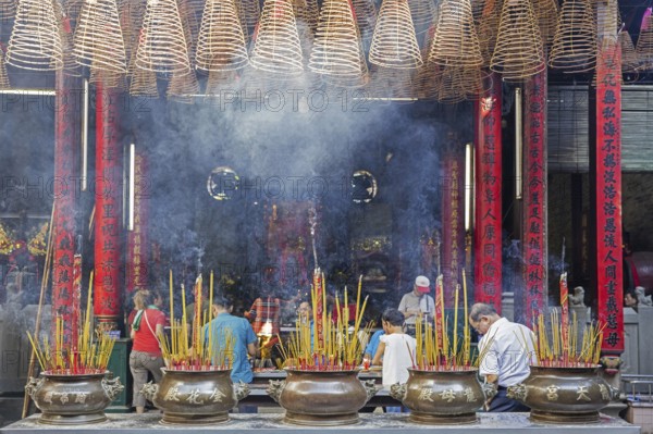 Burning incense sticks and spirals at the Thien Hau Temple, Ba Thien Hau Pagoda for Chinese Goddess of Sea, Mazu, in Ho Chi Minh City, Vietnam, Asia