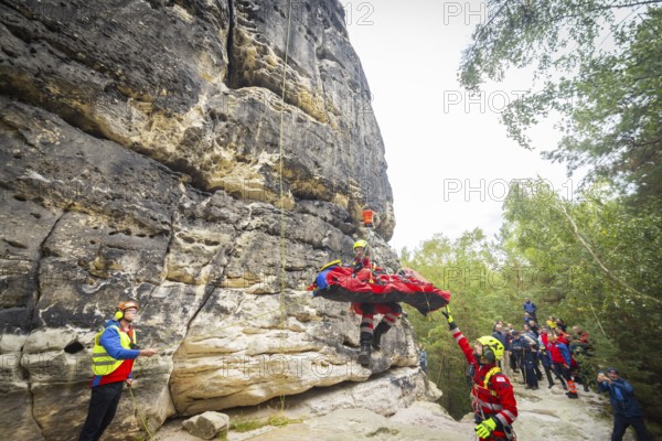 Winch rescue training of the rescue helicopter, Christoph 62, on the occasion of the 50th anniversary of the DRF Luftrettung. The rescue of casualties in the Elbe Sandstone Mountains will be practised