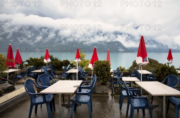 Empty restaurant, café, bad weather on the lake promenade at Lake Brienz, Brienz, Canton Bern, Bernese Oberland, Switzerland, Europe