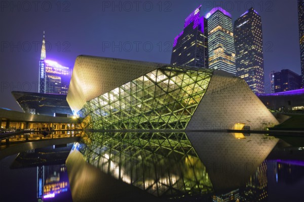 GUANGZHOU, CHINA, APRIL 27, 2018: Guangzhou Opera House designed by famous Iraqi architect architect Zaha Hadid illluminated at night