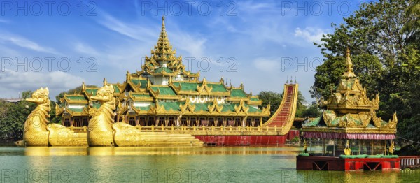Panorama of Yangon icon landmark and tourist attraction: Karaweik, replica of a Burmese royal barge at Kandawgyi Lake, Yangon, Myanmar (Burma)