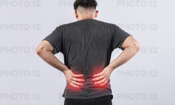 Lumbar problems concept, Sore man with back pain isolated. Man with spine problems isolated