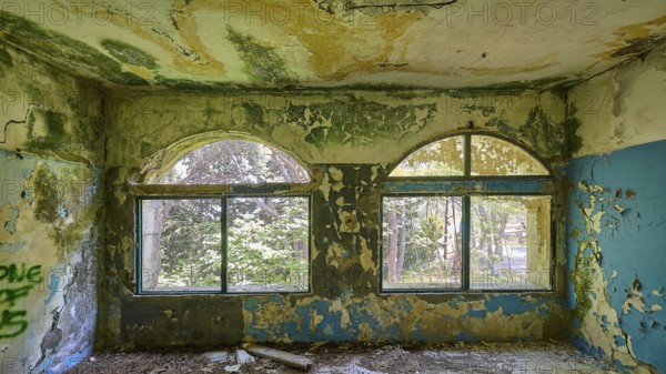 Dilapidated arched windows in an abandoned building with traces of decay and blue walls, Lost Place, Former Santorium, Tuberculosis Centre 1947-1970, Former Italian Colonial Settlement, Eleousa, Campochiaro, Rhodes, Dodecanese, Greek Islands, Greece, Europe
