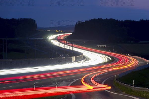 Tracers on the A8 motorway, winding road, evening, long exposure, Swabian Alb, Baden-Württemberg, Germany, Europe