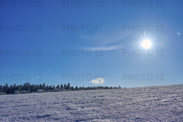 Wide expanse of snow under a clear blue sky with bright sun, winter, Wasserkuppe, Gersfeld, Rhön, Hesse, Germany, Europe