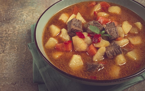 Meat goulash, with potatoes and carrots, sweet pepper, traditional Hungarian soup, homemade, no people