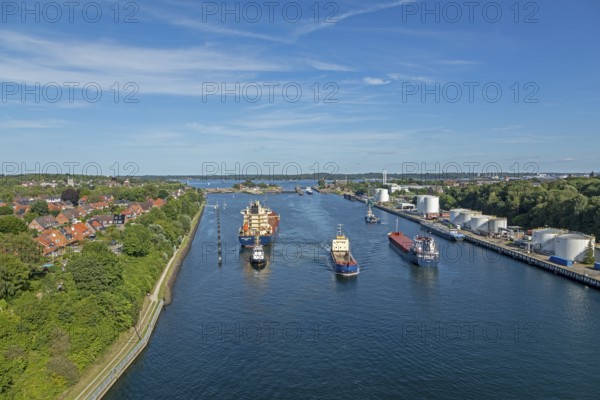 Cargo ships waiting in front of the lock, Kiel Canal, Holtenau, Kiel, Schleswig-Holstein, Germany, Europe