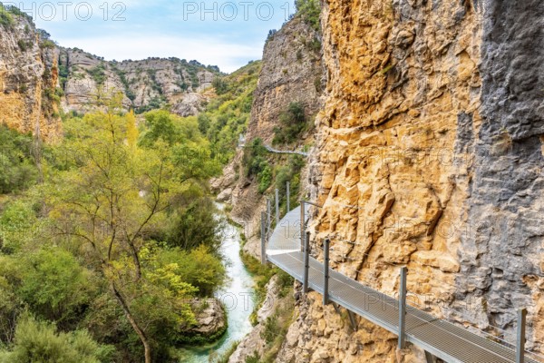 Metal walkways on the wall of the path next to the Vero River in Alquezar. Pyrenees
