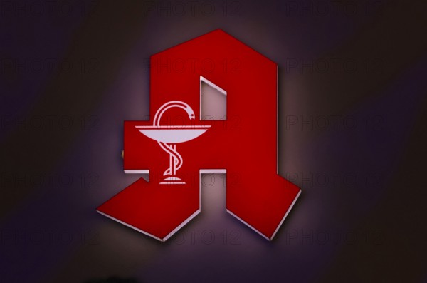 Night shot, logo, red neon sign, pharmacy sign with Aesculapian staff, Aesculapian staff, Stuttgart, Baden-Württemberg, Germany, Europe