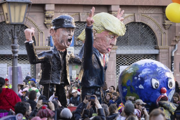 The Frankfurt carnival parade will parade across the Römerberg in Frankfurt am Main on 2 March 2025. A float shows US President Donald Trump with his advisor Elon Musk and the globe, Römerberg, Frankfurt am Main, Hesse, Germany, Europe