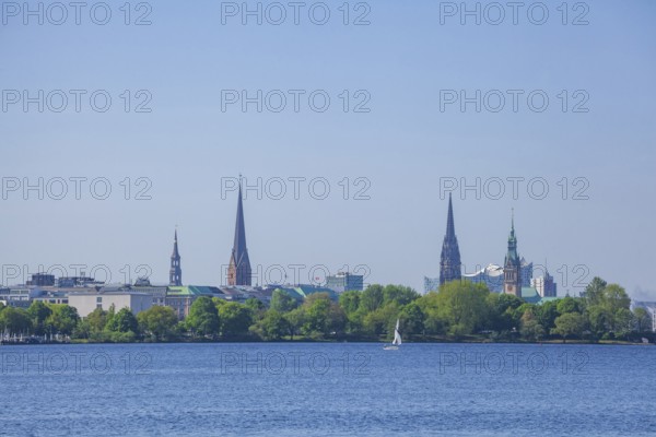 Outer Alster with St Peter's Church, City Hall, Elbe Philharmonic Hall concert hall and the former main church of St Nikolai, Hamburg, Germany, Europe