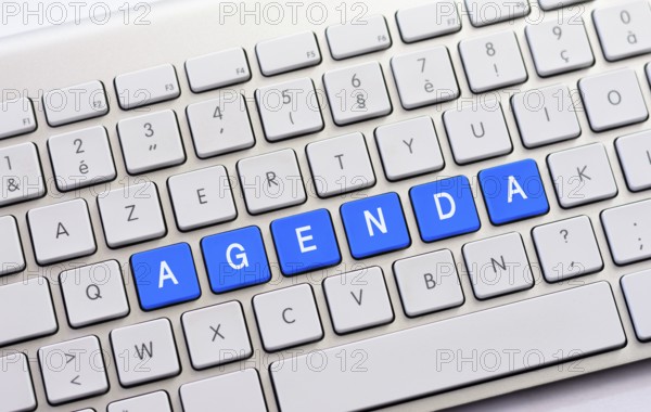 AGENDA writing on white keyboard