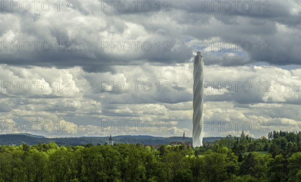 The TK-Elevator test tower in Rottweil next to a church tower. The 246 metre high lift test tower for express and high-speed lifts offers the highest visitor platform in Germany and is the world's second highest test tower for lift systems, Rottweil, Baden-Württemberg, Germany, Europe