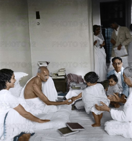 Mahatma Gandhi playing with child, Birla House, Mumbai, Maharashtra, India, Asia, June 1945, Asia