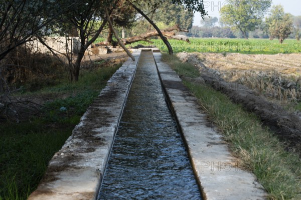Water canal for crop field irrigation system in the village