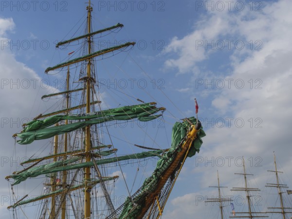 The masts and sails of a large sailing ship against a blue sky with few clouds, bremerhaven, bremen, germany