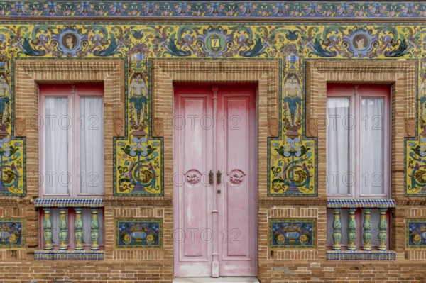 Isla Cristina, Spain - 7 January 2021: colorful tile and red brick house front in detail