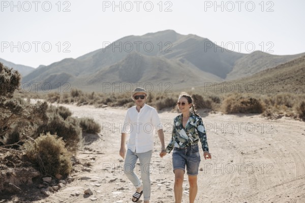 Couple walking in a South African landscape, near Cape Town