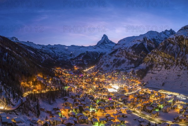 Zermatt Town and Matterhorn Mountain at Winter Night. Swiss Alps, Switzerland. Aerial View