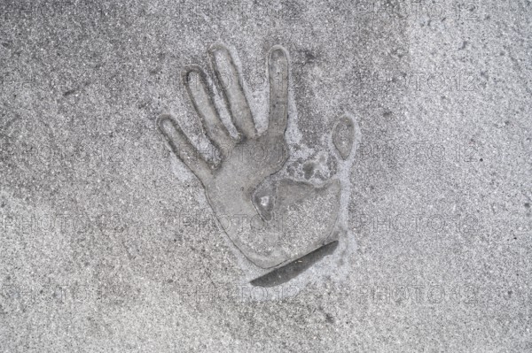 01/05/2023, Berlin, Germany, Europe, A handprint left on the tarmac with superglue a few days after a climate demonstrator of the so-called Last Generation glued himself to the tarmac at Ernst-Reuter-Platz in Berlin-Charlottenburg and was removed by the police, causing severe traffic obstructions. The activists' main demands are an affordable 9-euro ticket for everyone and a general speed limit of 100 km/h on German motorways. The group is also calling on the German government to take more drastic measures to reduce greenhouse gas emissions and to phase out the use of all fossil fuels by 2030, as well as a social council, Europe