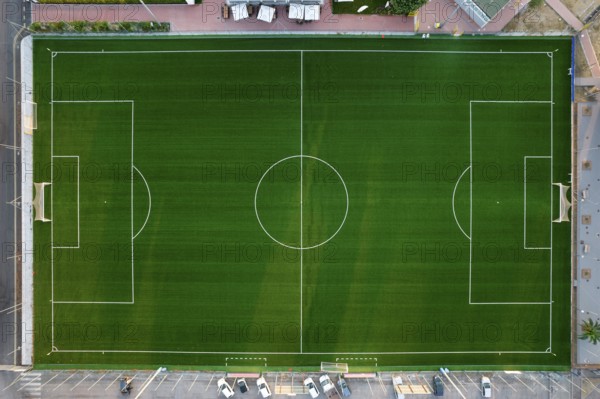 Aerial photographic documentation of an empty green football pitch