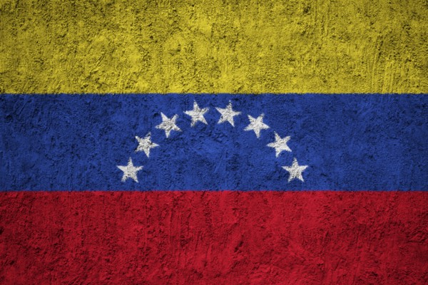 Venezuela Flag painted on the cracked grunge concrete wall