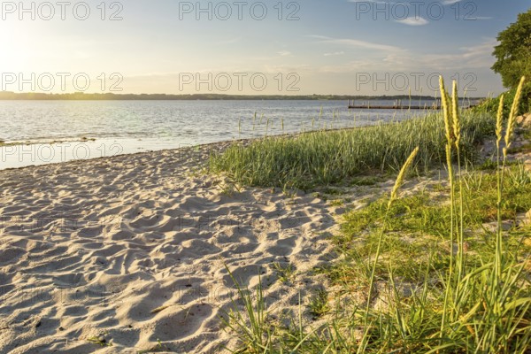 Sunset on a quiet beach in Glücksburg on the Flensburg Fjord in northern Germany