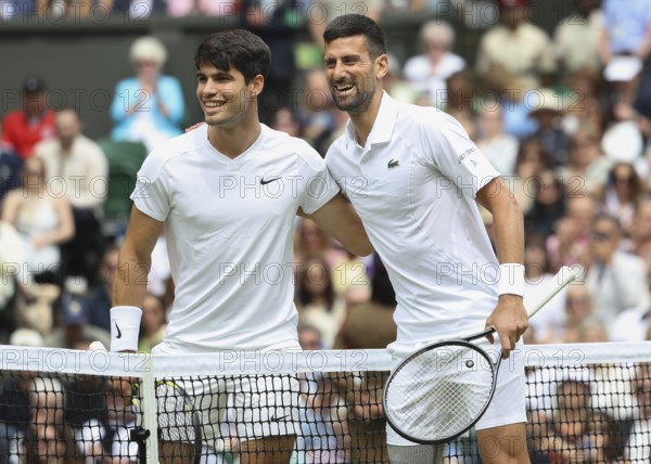 Carlos Alcaraz (ESP) und Novak Djokovic (SRB) posing at the net before the start of the finals at the 2024 Wimbledon Championships, London, England, United Kingdom, Europe