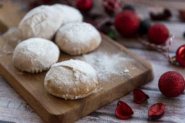 Traditional delicious Greek almond snow balls or Christmas cookies called kourabiedes with almonds and powered with white sugar